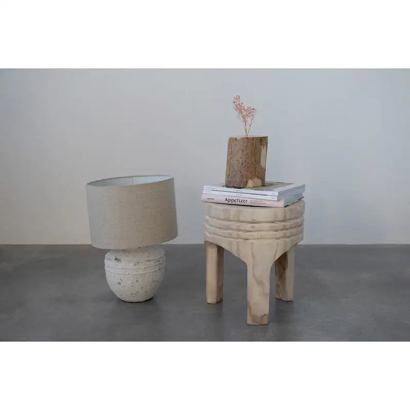 Tabouret rond sculpté en bois de paulownia naturel